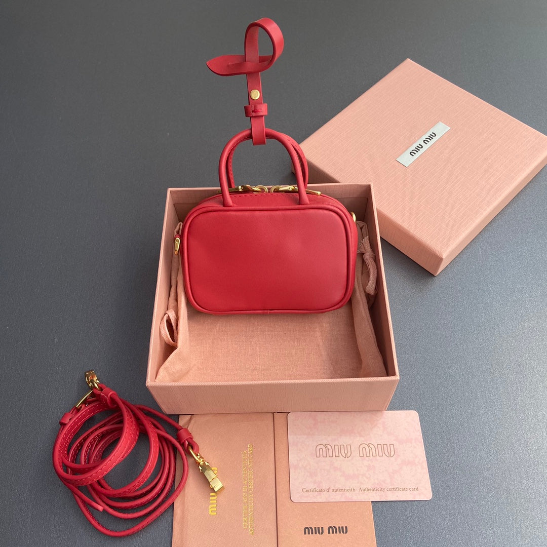 MICRO BAG KEYCHAIN 11 IN TALL POPPY RED CALFSKIN EMBOSSED LOGO
